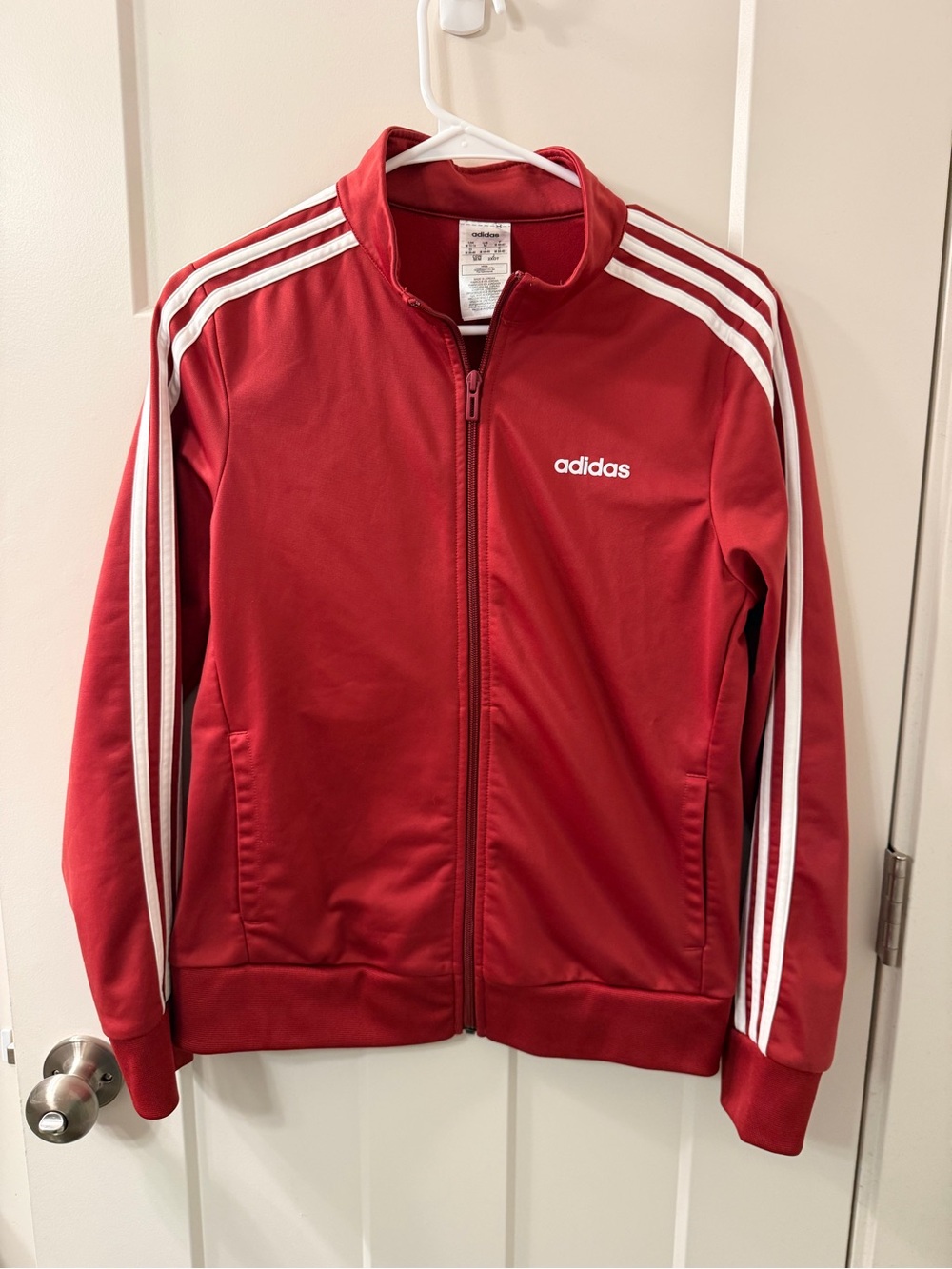 Adidas women’s copper color track jacket with 3 strip size medium